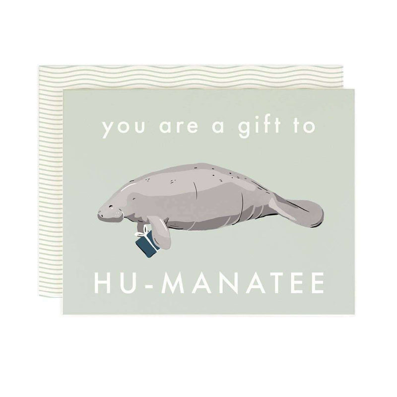 Manatee-themed greeting card with "Gift to Hu-manatee" text, warm white paper, and coordinating envelope.