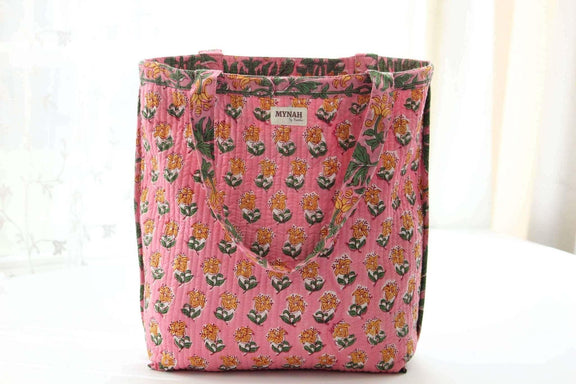 Handmade Bubblegum Forest floral print reversible tote bag with quilted design and coconut button loop.