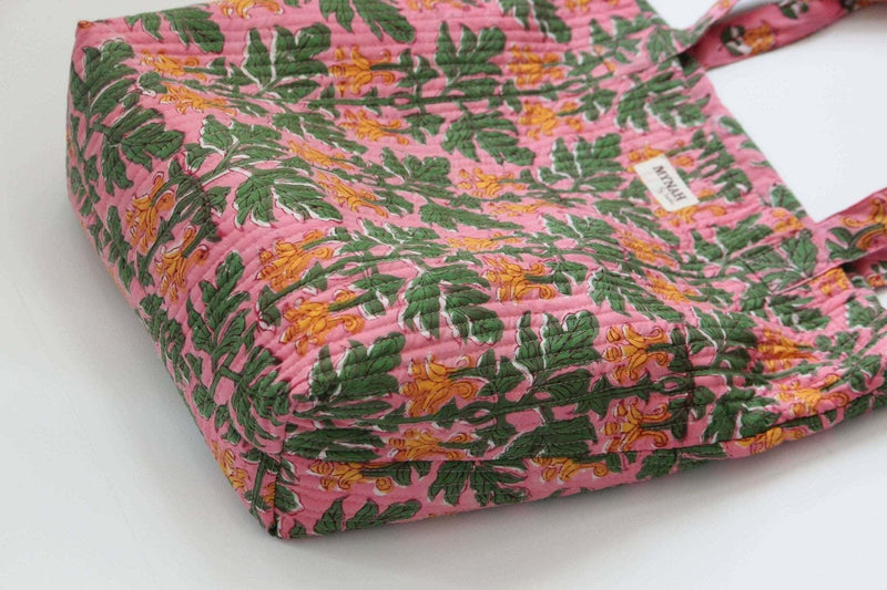 Handmade Bubblegum Forest floral print reversible tote bag with quilted design.