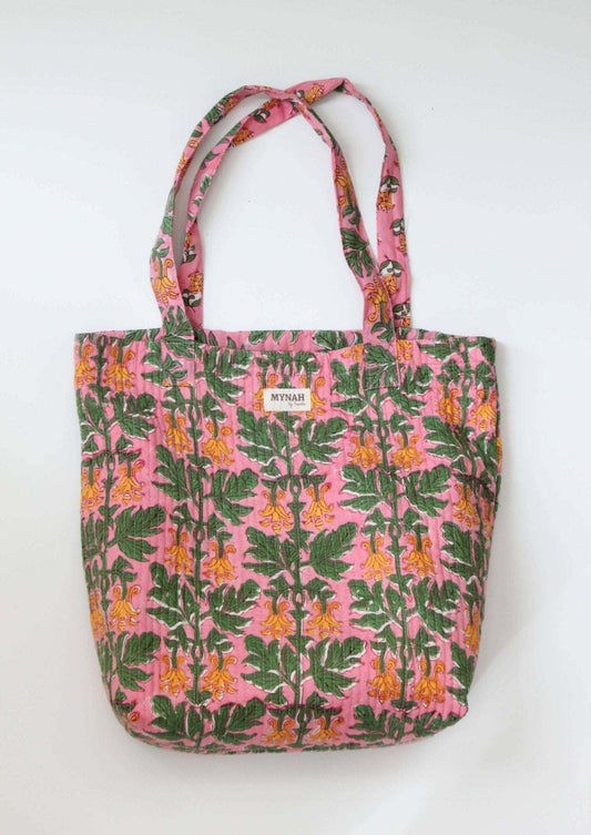 Handmade Bubblegum Forest floral print reversible tote bag with quilted design and coconut button closure.