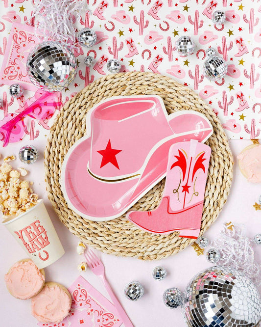 Pink cowgirl hat shaped paper plate with gold foil accents for Wild West themed parties.