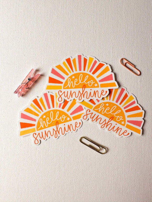 Hello Sunshine Sticker with vibrant sunburst design, ideal for personalizing laptops, phones, and journals.
