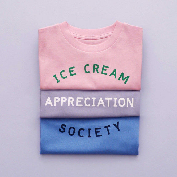 Women's pink t-shirt with "Ice Cream Appreciation Society" design in green text.