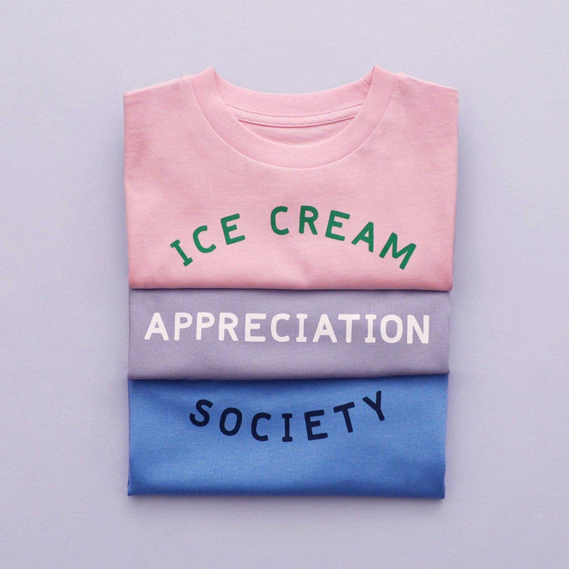Women's pink t-shirt with "Ice Cream Appreciation Society" design in green text.