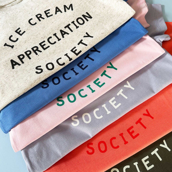 Women's pink "Ice Cream Appreciation Society" T-shirt with green text, organic cotton.