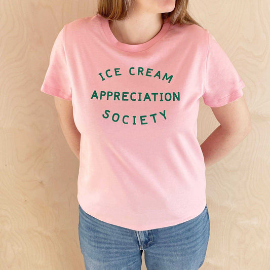 Women's pink t-shirt with "Ice Cream Appreciation Society" green print.