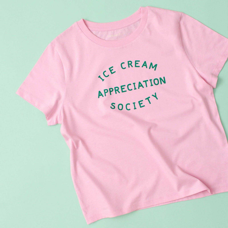 Women's pink t-shirt with "Ice Cream Appreciation Society" in green text, organic and vegan-friendly.