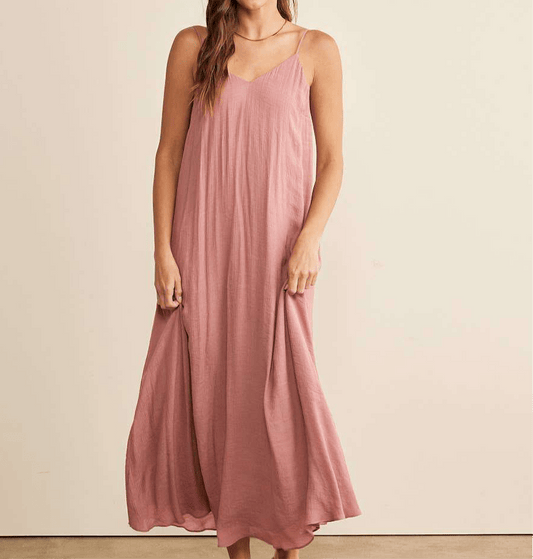 Flowy maxi dress with V-neck and adjustable spaghetti straps.