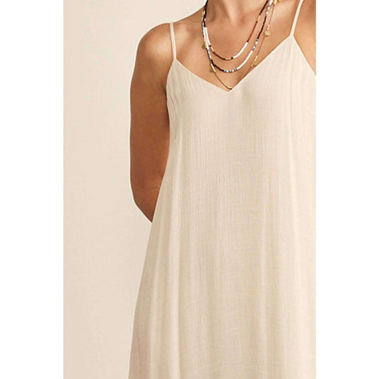 Flowy Maxi Dress with V-neck and adjustable spaghetti straps, fully lined.