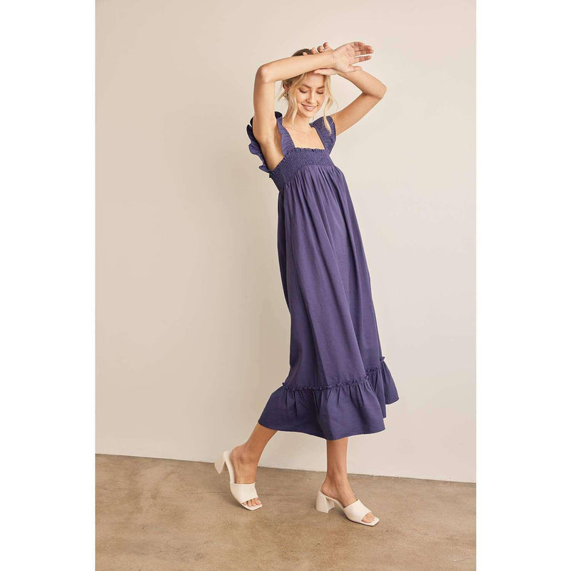 Navy ruffle sleeve square neck smocked midi dress with side seam pockets.
