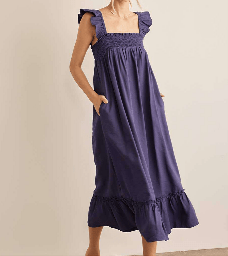 Navy ruffle sleeve smocked midi dress with square neck and pockets.