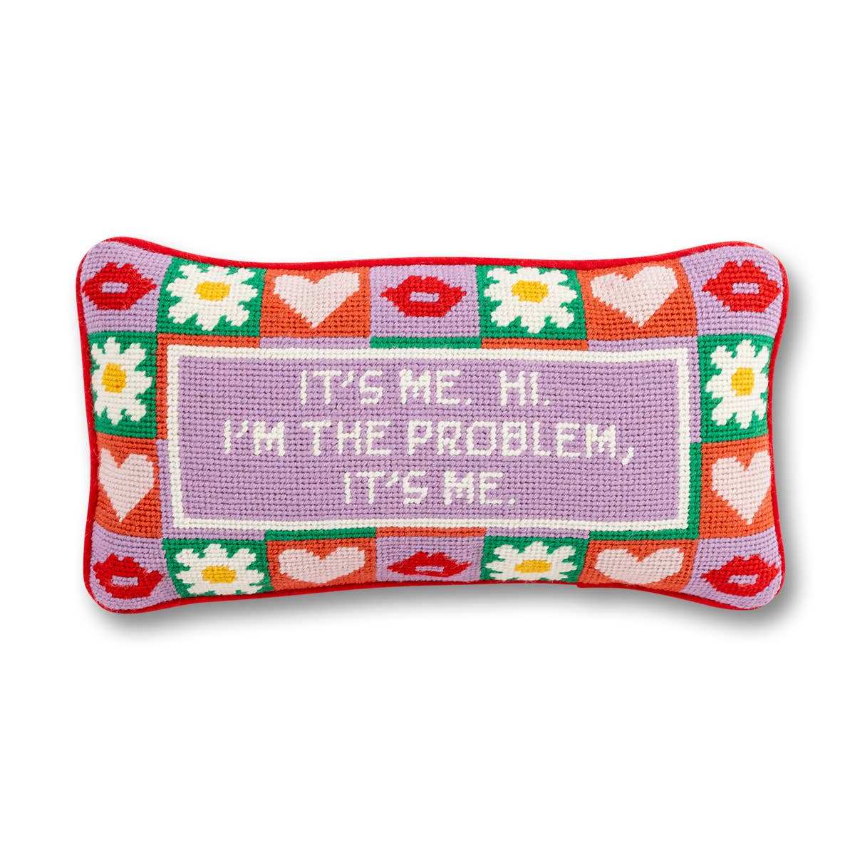 Chic needlepoint pillow with playful phrase, red velvet backing, and colorful design.