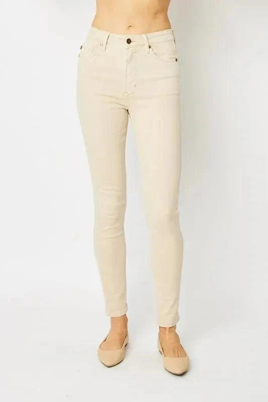 Judy Blue Garment Dyed Tummy Control Skinny Jeans in beige with high-rise waist and slight stretch.