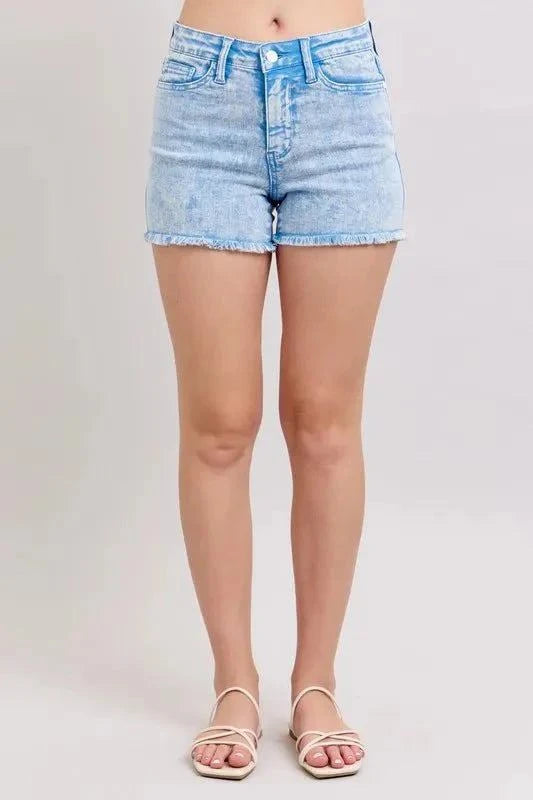 Judy Blue mid rise garment dyed denim shorts with raw hem and pockets.