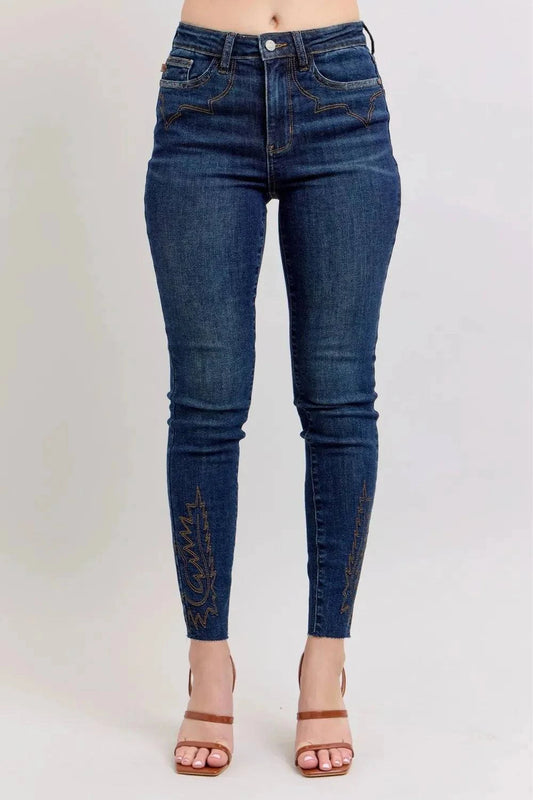 Embroidered high rise skinny jeans with intricate details and flattering fit.