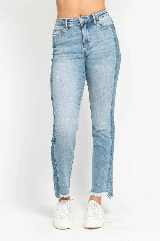 Vintage wash slim jeans with side panel and fray hem detail.