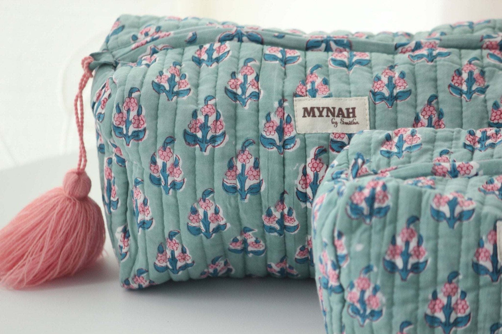 Large Eucalyptus floral travel bag with quilted design and waterproof lining.