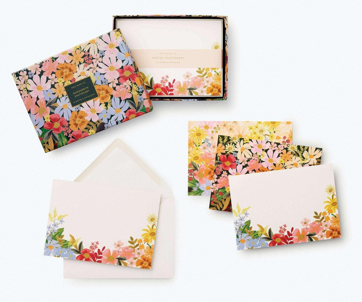 Marguerite Stationery Set with floral designs and matching envelopes in a decorative box.