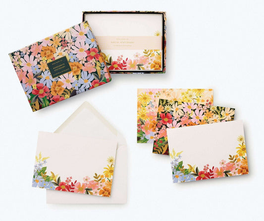 Marguerite Stationery Set with floral designs and matching envelopes in a decorative box.