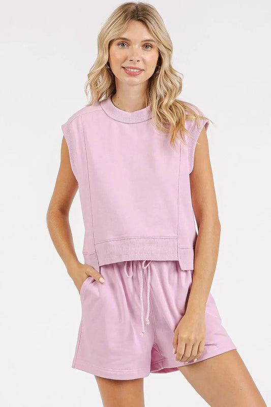 Female model wearing pink Mittoshop French Terry Crew Neck Top and Shorts Set, featuring a sleeveless top and drawstring shorts, perfect for casual lounging.