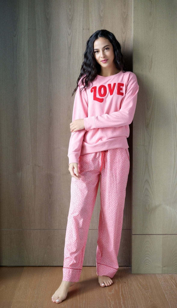 Pink "LOVE" sweatshirt made of cotton, polyester, and rayon.