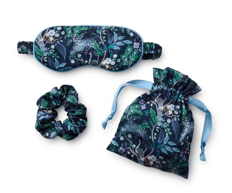 Rifle Paper Co. Peacock Sleep Travel Set with silky eye mask, scrunchie, and drawstring bag featuring lush peacock print.