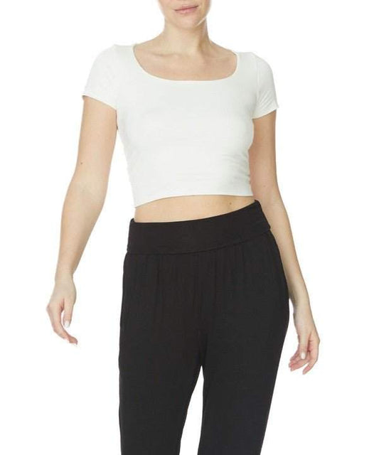Studio Ko Bamboo Crop Cap Sleeve Top with U-neckline and black pants.