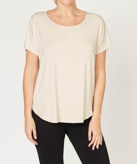 Studio Ko Bamboo Dolman Top with scoop neck, high-low hemline, and dolman sleeves in an eco-friendly bamboo viscose blend.