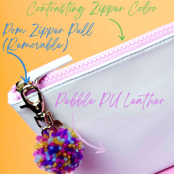 Swiftie Colorblock Script Bag with vegan leather, pink zipper, and removable pom zipper pull.