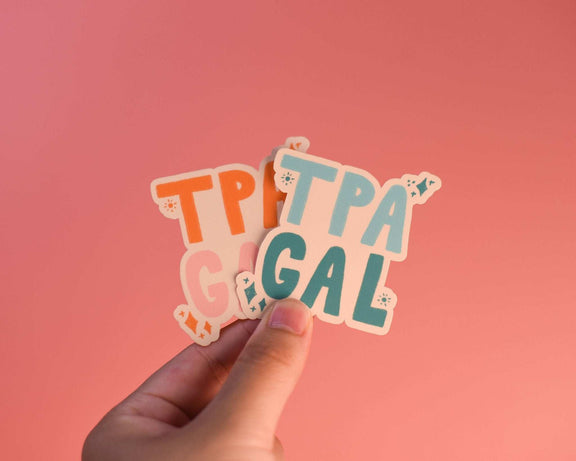 Tampa Gal Sticker held against a pink background, ideal for decorating laptops and water bottles.