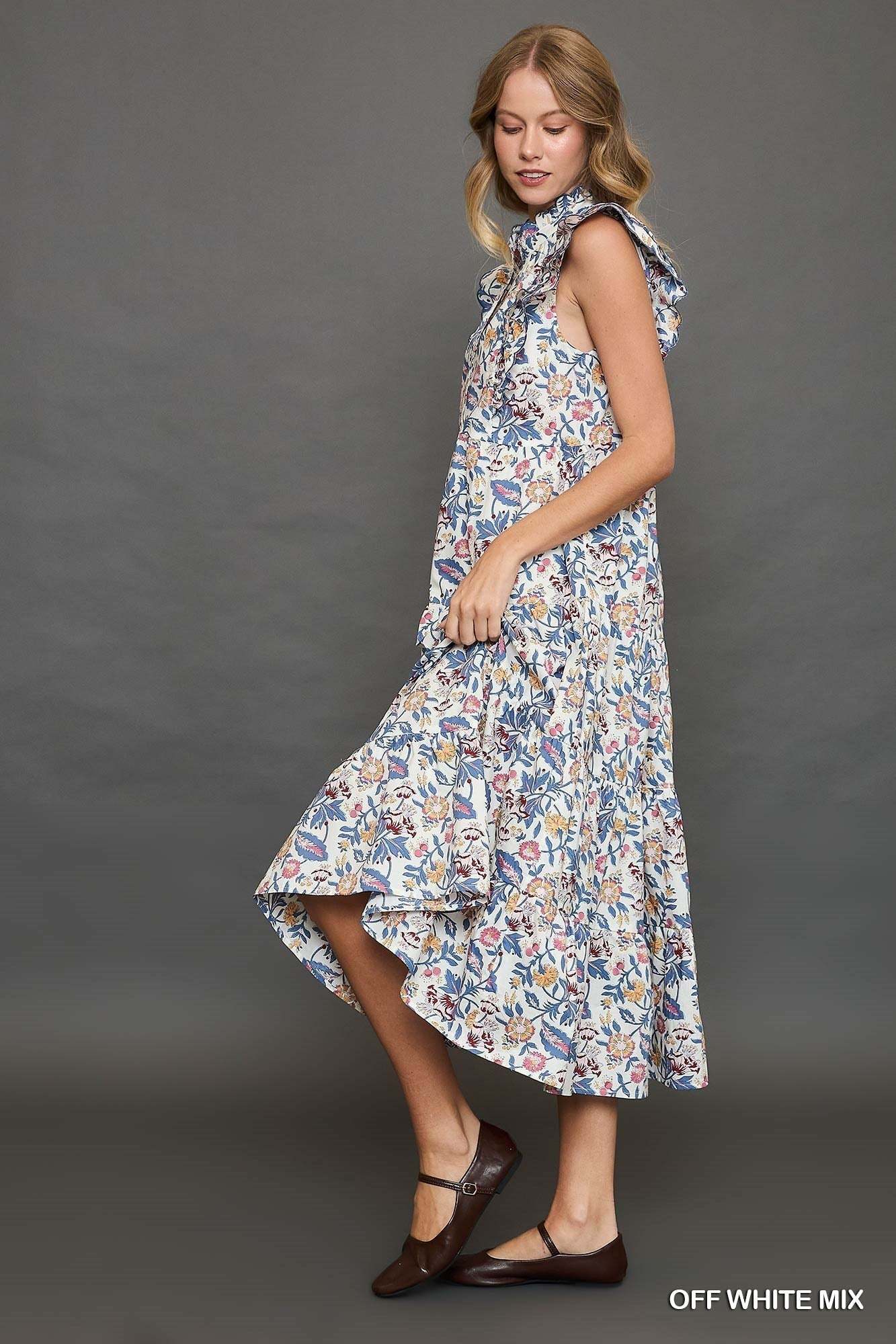 Floral garden print tiered maxi dress with ruffle cap sleeves in blue and cream.