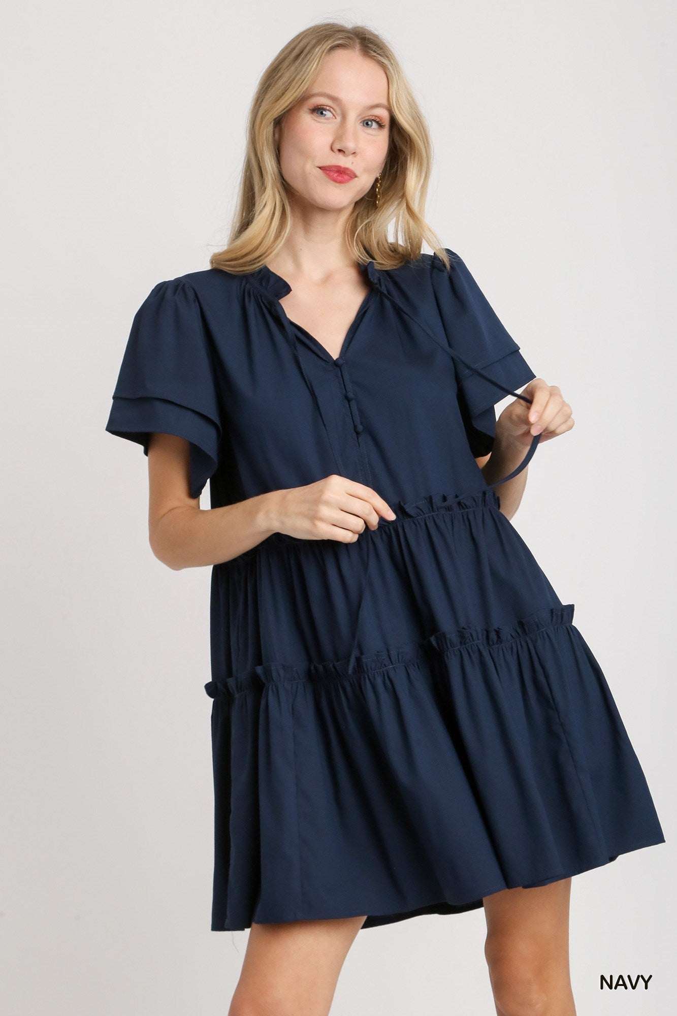 Umgee Navy Tiered Ruffle Short Sleeve Dress with tie front and trim details.