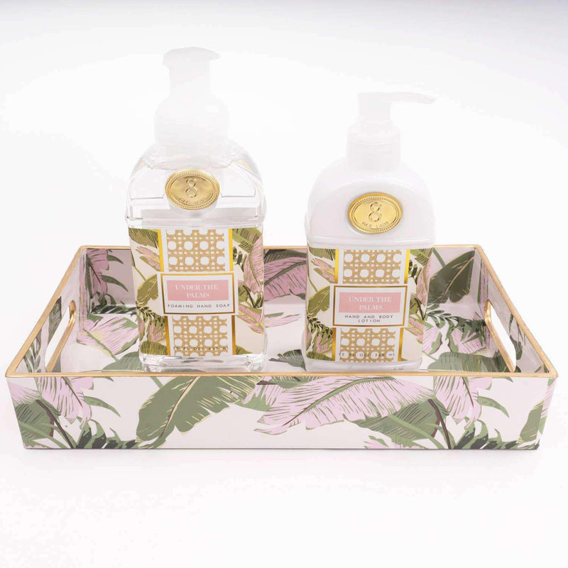 Under the Palms 300ml Hand & Body Lotion with botanical print packaging on decorative tray.