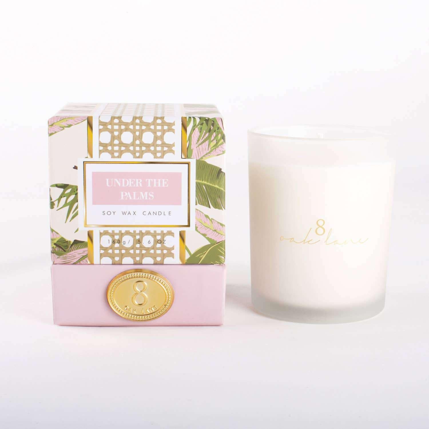 Under the Palms 5.6oz soy wax candle with botanical print packaging.