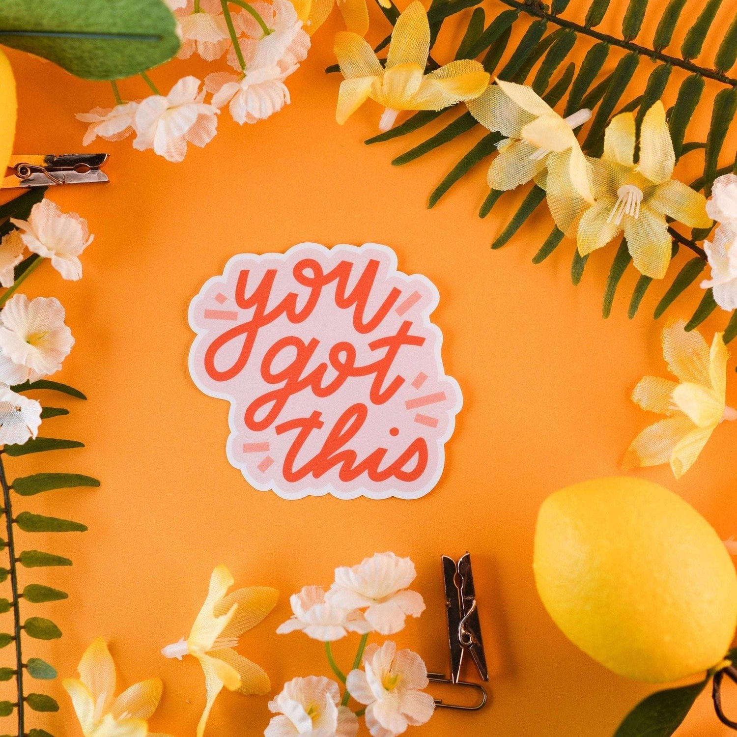 Cute 'You Got This' sticker amidst flowers and lemons, ideal for laptops, phones, and journals.