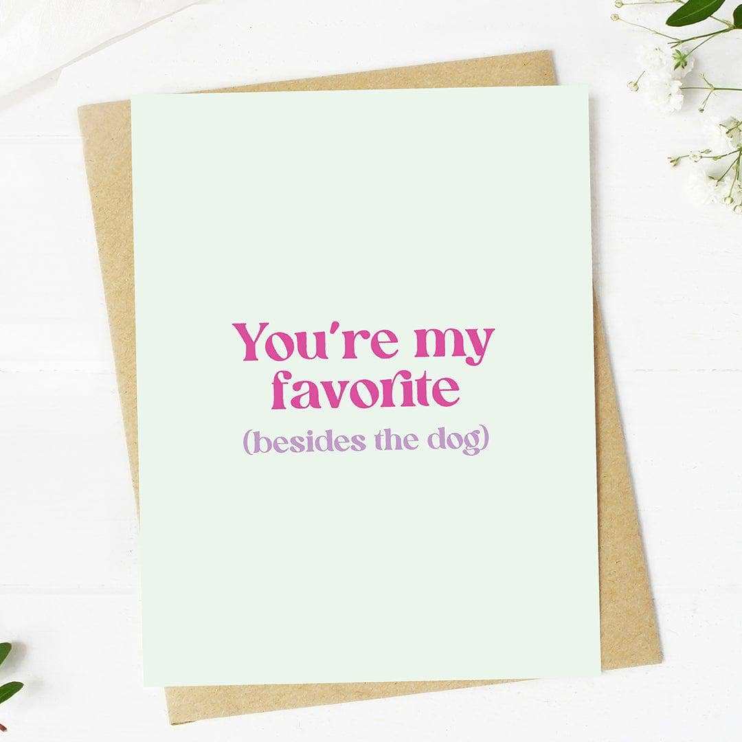 Funny Valentine's card with "You're my favorite (besides the dog)" text on premium cardstock, A2 size, paired with kraft envelope.